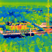 Aerial thermograph of apartment building with poor energy efficiency