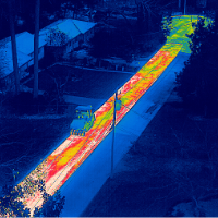 Aerial thermograph of roadworkers finishing asphaplt surface